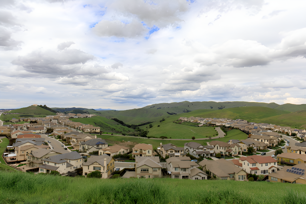 Scenic aerial view from the hills in Dublin, CA, overlooking a thriving real estate community and beautiful natural surroundings.