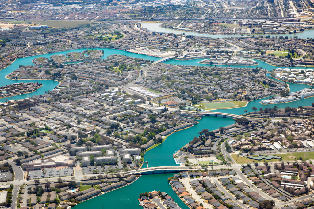 Newark, CA, cityscape aerial view with residential neighborhoods and commercial areas, highlighting real estate opportunities.