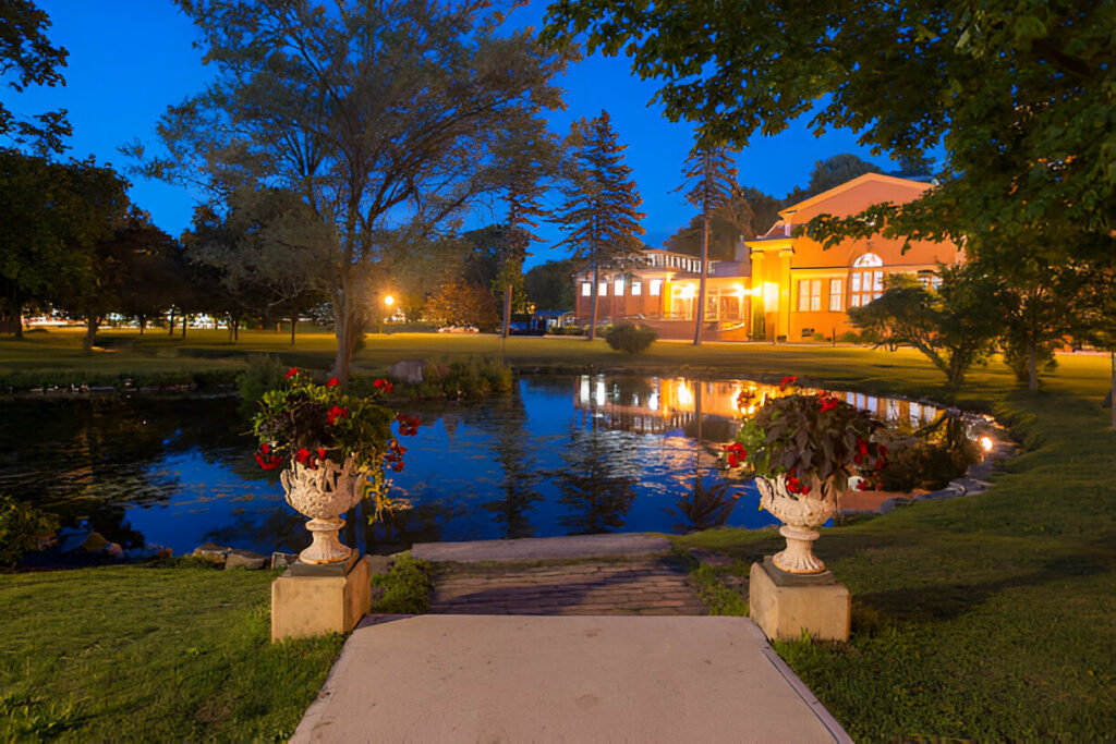 Saratoga, CA estate featuring a peaceful pond, lush greenery, and a spacious residential property in a sought-after neighborhood.